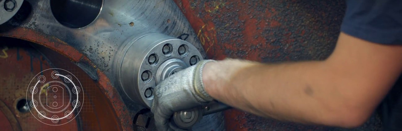 Photo of a worker's arm turning a valve