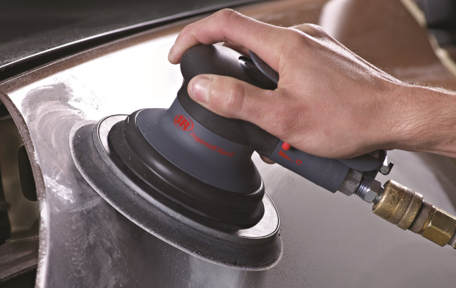 Photo of a worker's hands using a sander