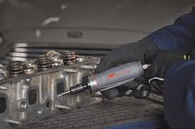 Photo of a worker's hands using a straight grinder